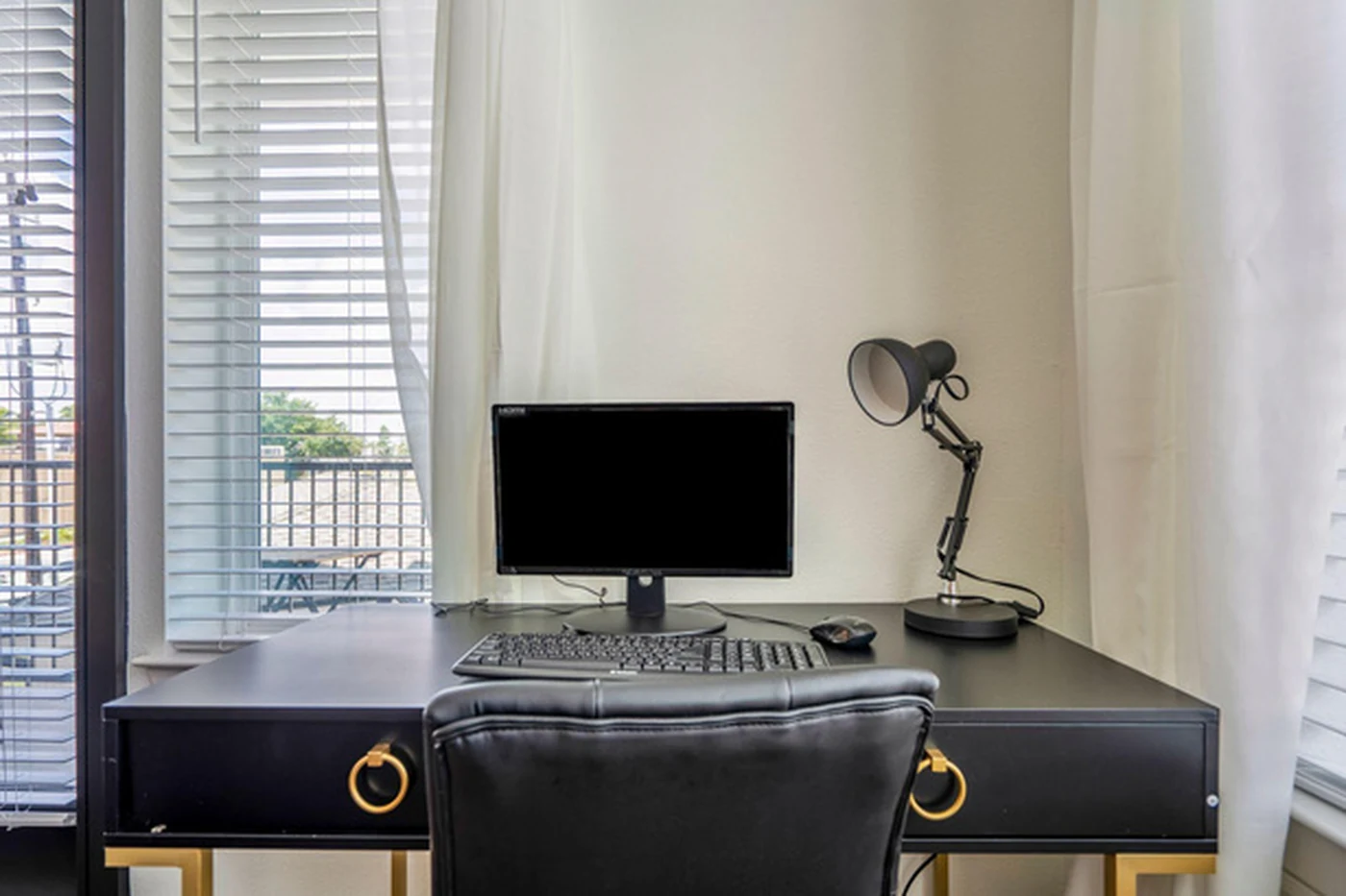 Work-ready furnished desk area for professional guests